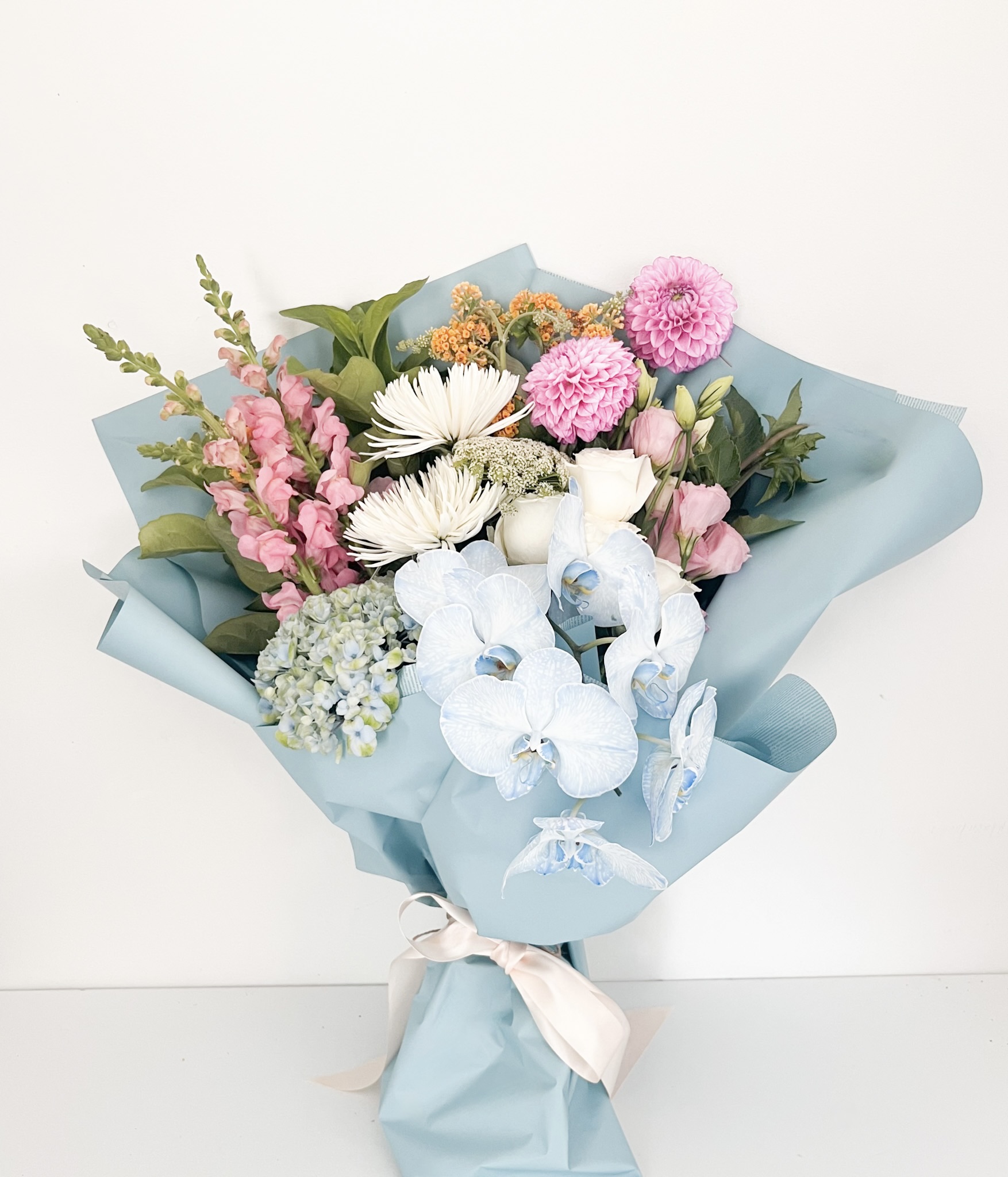 Designers Choice Bouquet Premium size in Pastel colours wrapped in pastel paper